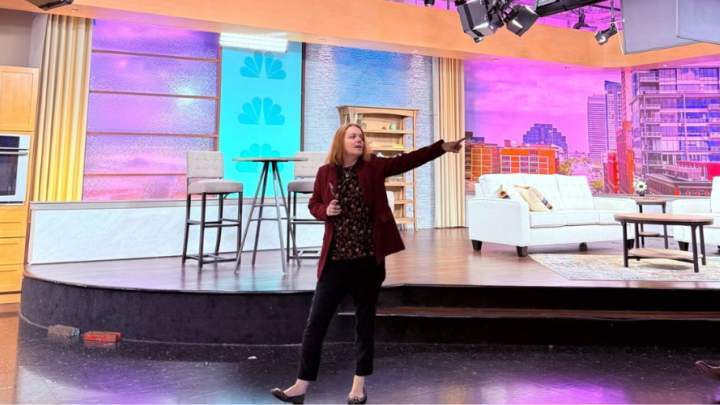 Julie Flynn, news director at Cleveland's WKYC, leads students on a tour of the station’s studio on Sept. 25, 2025