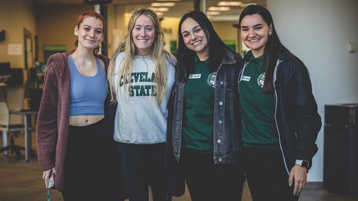 few students smiling at camera